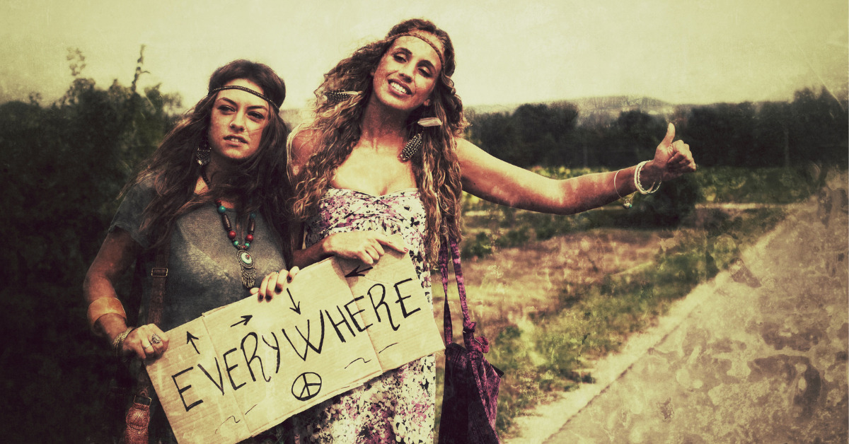 two hippie women hitch hiking